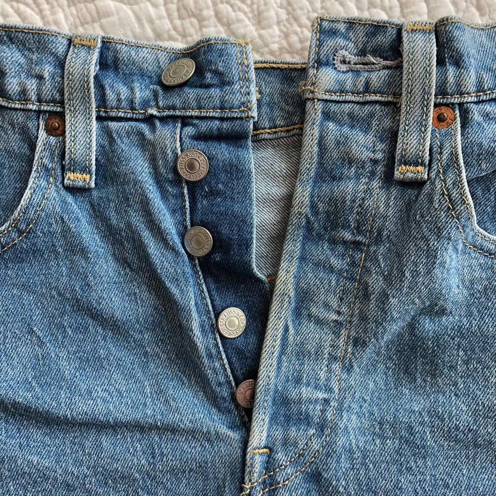 Levi’s distressed retro high waisted shorts. Medium blue jeans. Size 26 waist.